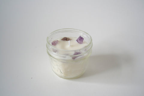 an 4oz Soy Candle made with essential oils and Amethyst. 